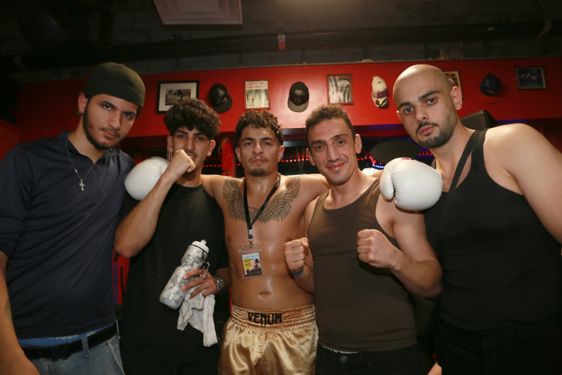 DKM Academy fight team celebrating with their fighter after a bout
