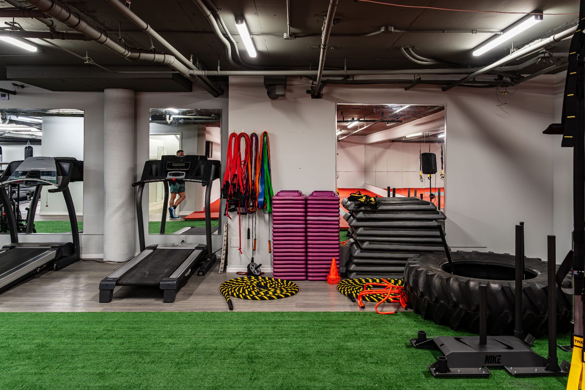 Treadmills, resistance bands, plyo steps and sled on turf