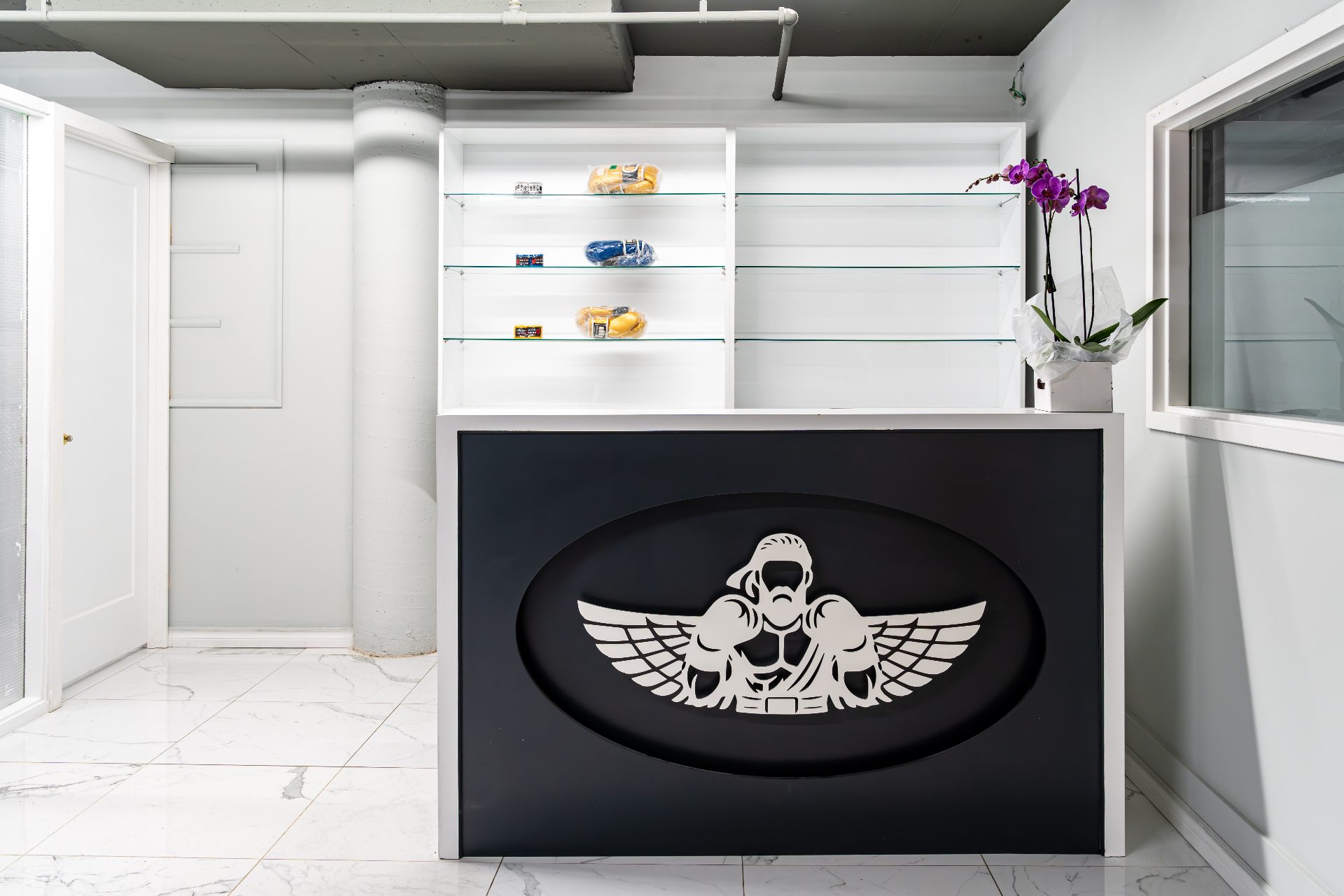 DKM Academy front desk and reception with brand crest